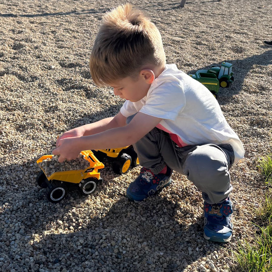 kid digging in rocks