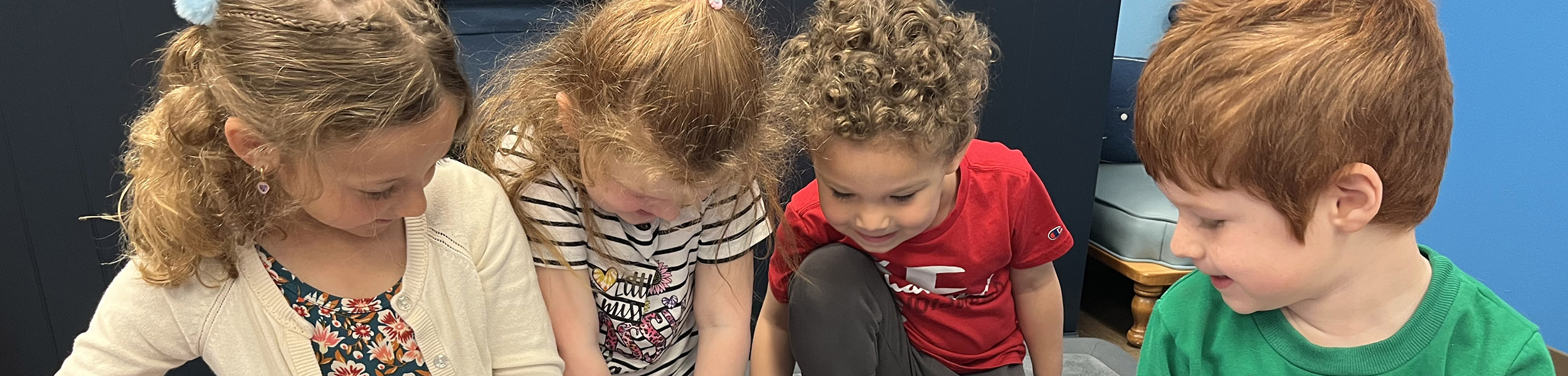 kids looking at puzzle